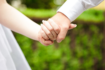 Bride and groom hands