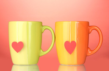 Two cups and tea bags with red heart-shaped label