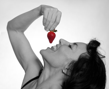 Sexy Mature Woman Eating A Strawberry