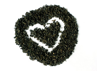 Green tea in heart and round shape isolated