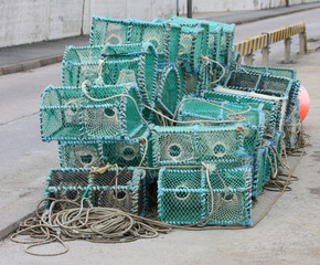 A Pile of Crab Fishing Pots on a Quayside.
