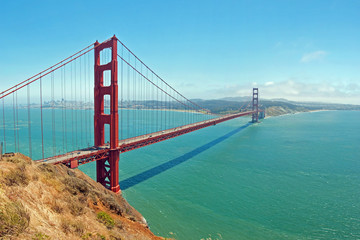 Fototapeta na wymiar The Golden Gate Bridge in San Francisco with beautiful azure oce