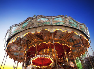 Vintage carousel at sunset in Paris
