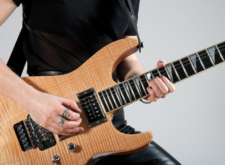 Fototapeta na wymiar Female guitarist playing electric guitar