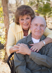 Senior Woman with Man Wearing Oxygen Tubes
