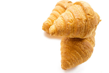 three croissant on a white background