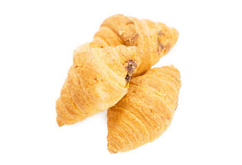 three croissant on a white background