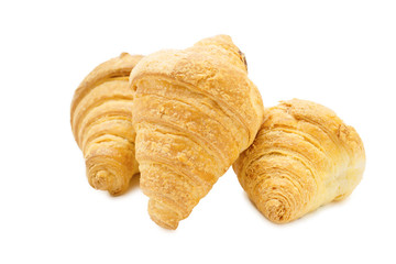 three croissant on a white background