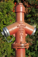 Close-up red fire hydrant on a street of Kemer, Turkey