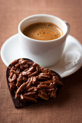 Chocolate valentine's heart and a cup of espresso