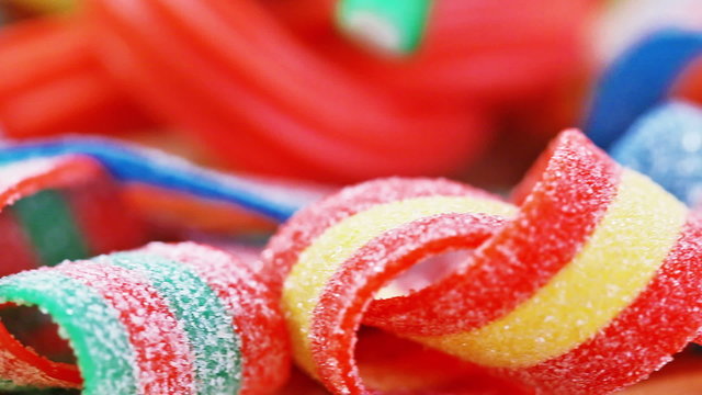 Gummy candy (licorice) rotating sweets background, closeup