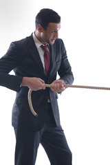 business man with rope isolated on white background