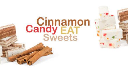 Sweets and cinnamon sticks isolated on white background