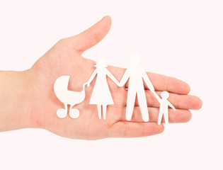 Fototapeta na wymiar paper family in hands isolated on white