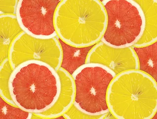 Poster Abstracte achtergrond van citrusvruchtenplakken. Detailopname. Studiofoto © oly5