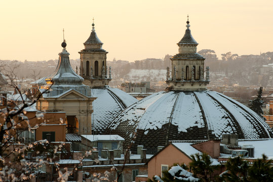 Domes of the "Twin Churches" covered in snow (Rome)