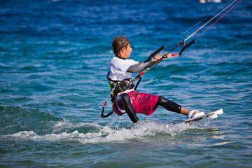 Kite surfing on the sea.