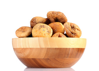 delicious dried figs in wooden bowl isolated on white