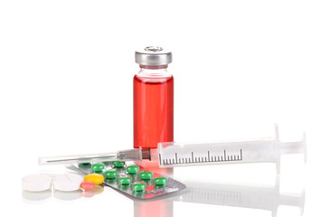 Syringe with medical ampoule and tablets isolated on white