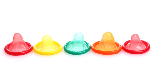 Colorful condoms isolated on white
