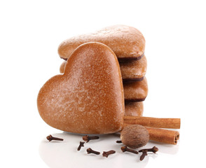 Heart-shaped cookies in stack with cinnamon, nutmeg and