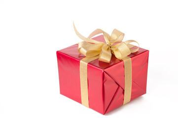 Gift wrapped with golden bow, white background