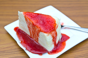 Cake with strawberry sauce topping