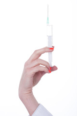 hand brings syringe