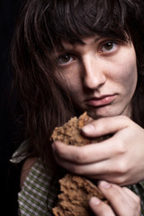 beggar woman with a piece of bread