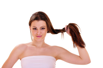 Portrait of a girl holding her hair in his hand.