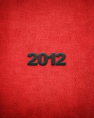 Fototapeta na wymiar red leather with 2012 word