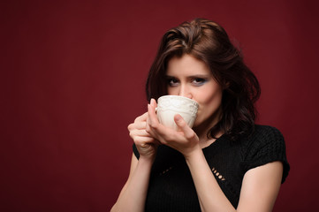 beautiful woman with cup of tea or coffee