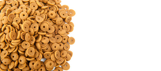 Professional dry pet food spread out on white background