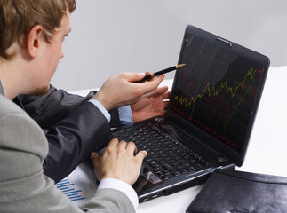 Close-up of business partners hands over papers discussing them