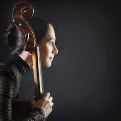 Woman playing cello player. Cellist profile © Alenavlad