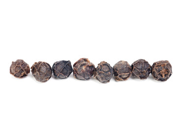 black pepper macro as isolation on white background