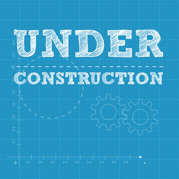 under construction text on a blueprint paper