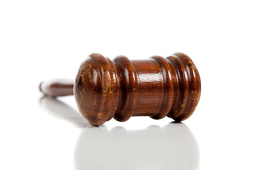 Brown gavel on a white background