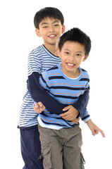 Two boys embracing isolated