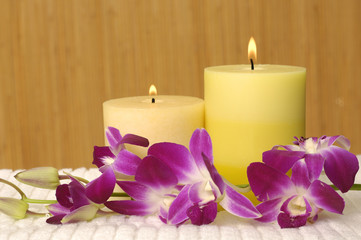 Fototapeta na wymiar Aromatherapy candles and pink orchid
