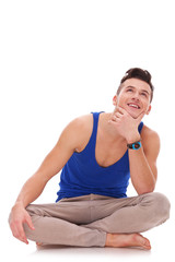 man thinking and looking up at something