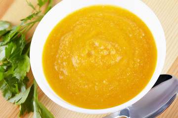 Pumpkin soup in white plate