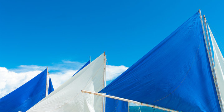 white and blue sails