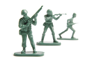 Three toy soldiers on a white background