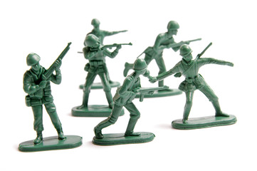 Green toy army engaged in battle