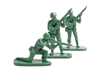 Three toy soldiers on a white background