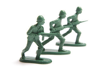 Three toy soldiers on a white background