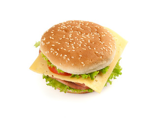 Big fast food sandwich with lettuce, ham, cheese and tomato