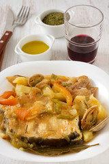 fish stew in the white plate