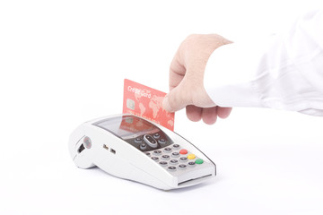 Hand with credit card swipe through terminal for sale